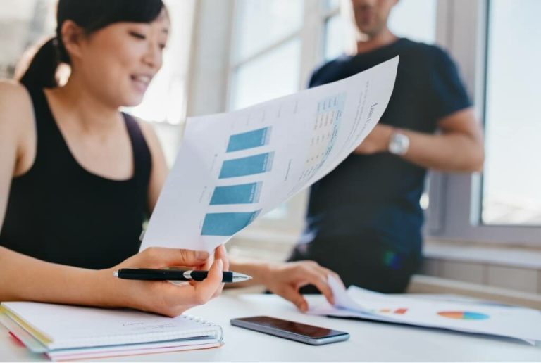 woman doing financial analysis at office PSXEZ74
